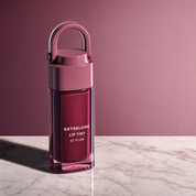 RELUME Juicy Lip Tint in 07 Plum on a plum studio background