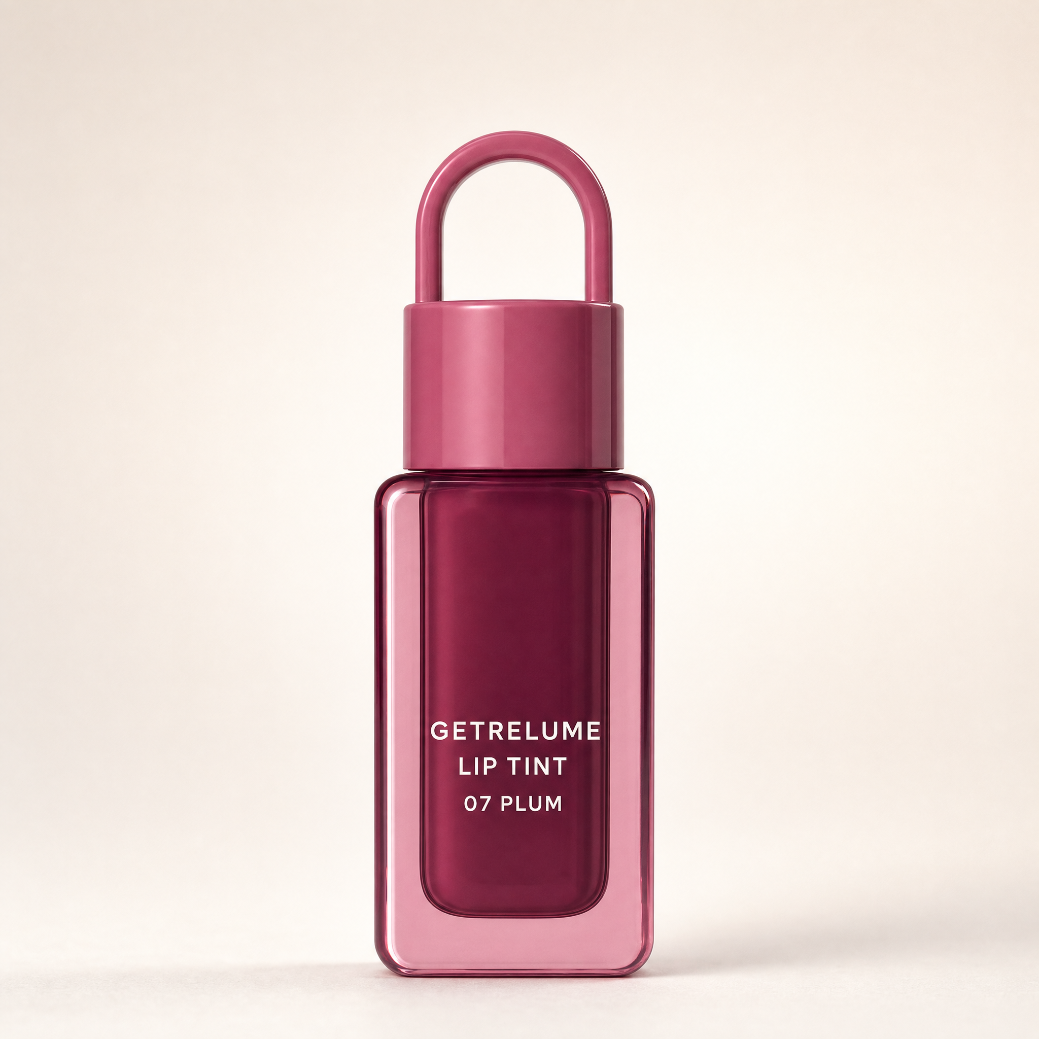 RELUME Juicy Lip Tint in 07 Plum on a clean cream background