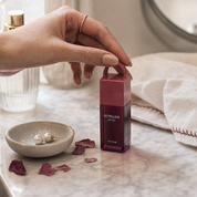 RELUME Juicy Lip Tint in a modern vanity setting