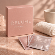 RELUME Under-Eye Masks box and sachets in a warm skincare ritual